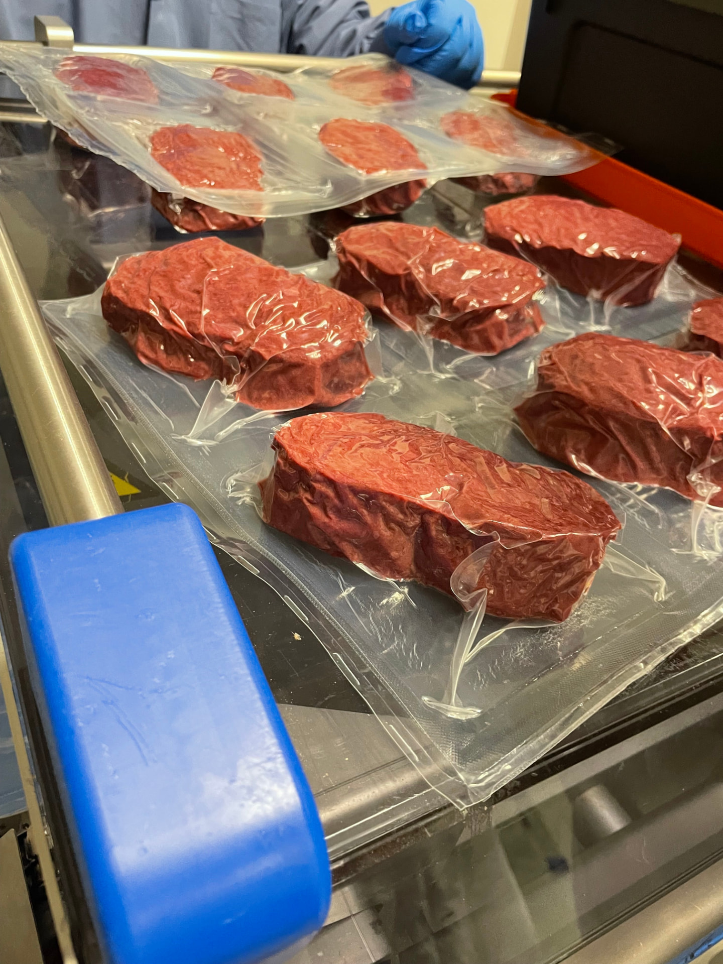Vacuum-packed Offbeast steaks moving along the production line